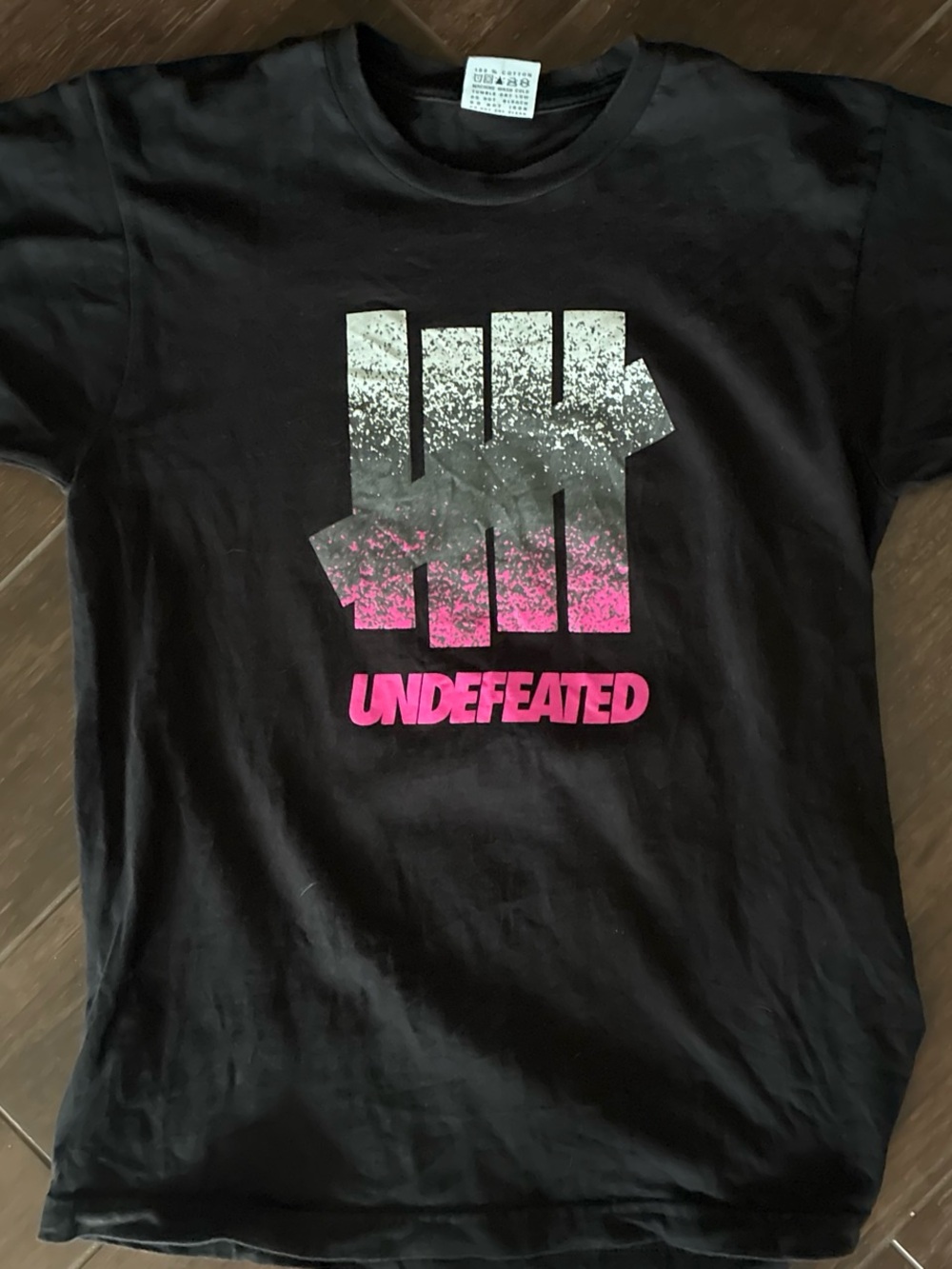 Preowned Undefeated Black Tee with Pink and White Gradient Logo. Men medium